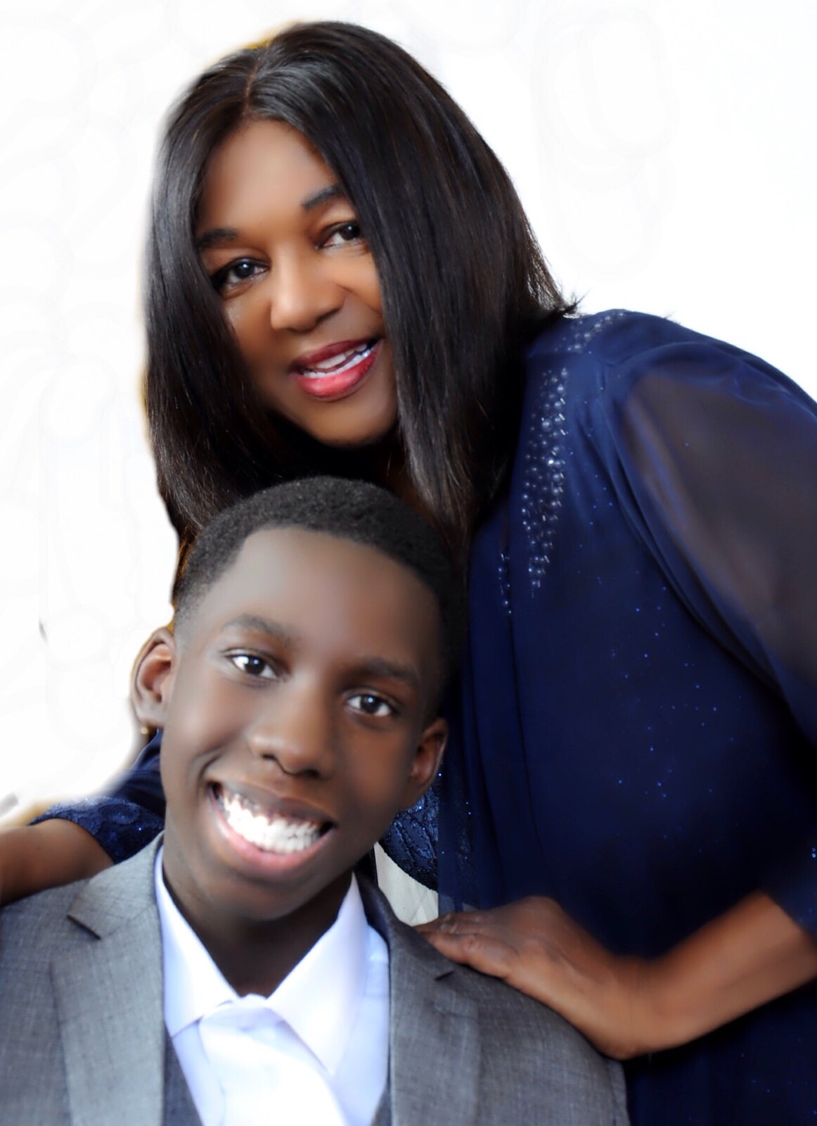 Young advocate Joshua D. Bailey smiling beside an adult woman